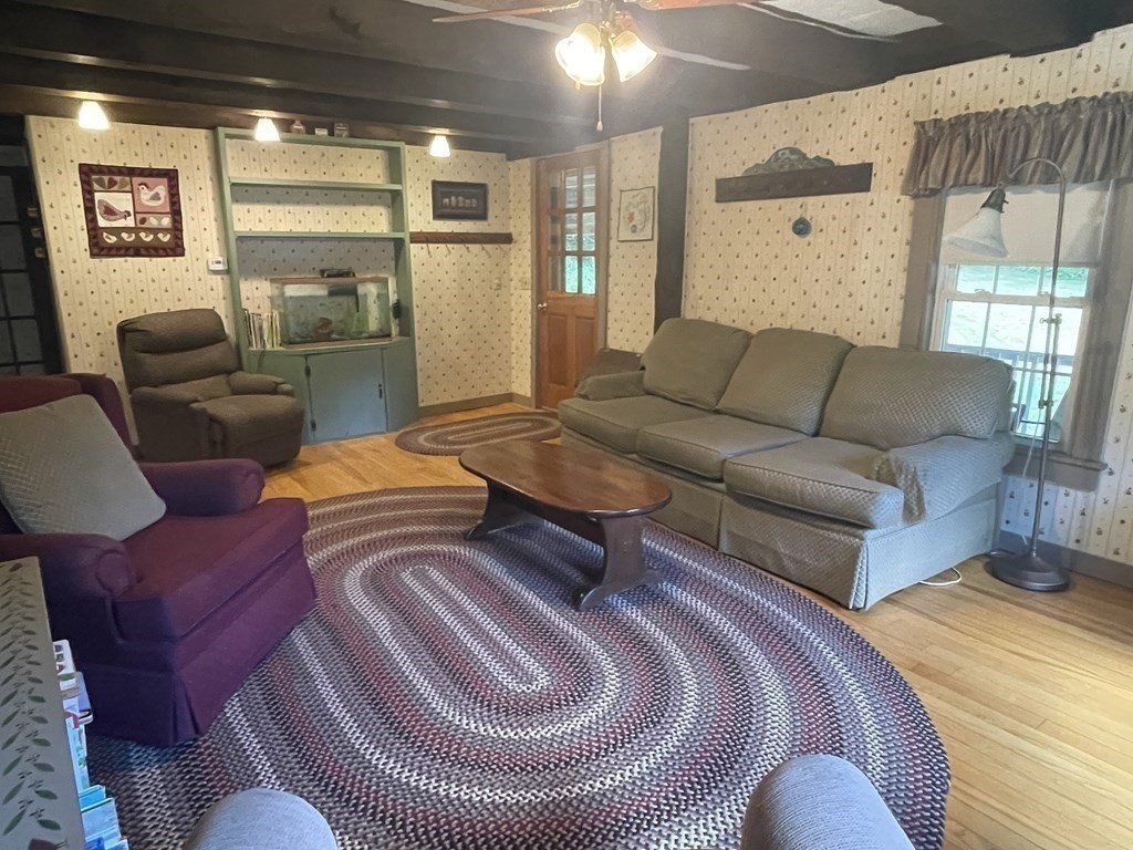95 West Gill Road Gill, MA 01354 - Photo 6 of 40 a living room with furniture and a large window