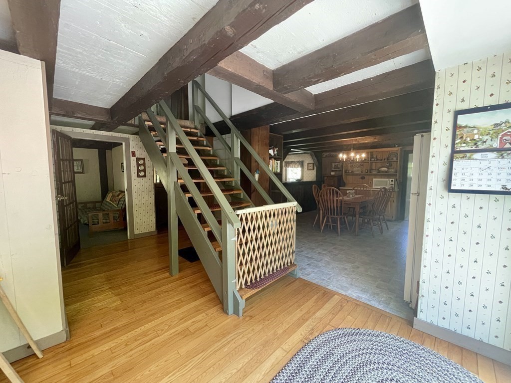 95 West Gill Road Gill, MA 01354 - Photo 10 of 40 a view of entryway dining room and hall with wooden floor