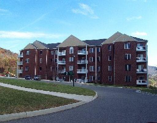 a large building with a yard in front of it