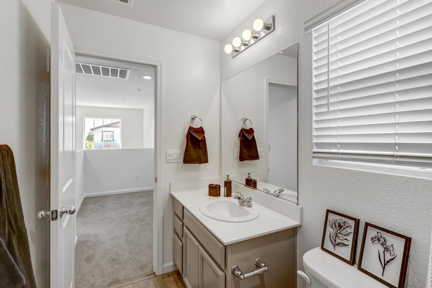 2887 Krone Way Antelope, CA 95843 - Photo 30 of 46 a bathroom with a sink and a mirror