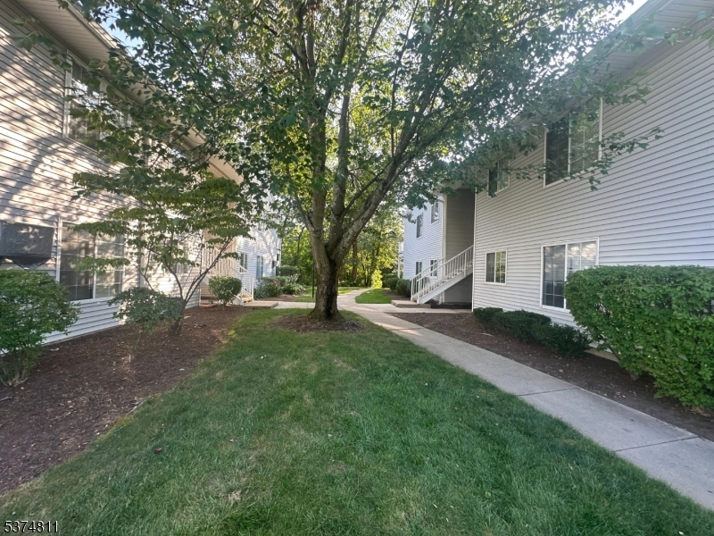 66 Mountain Court, Unit 66 Bedminster, NJ 07921 - Photo 13 of 18 a view of a house with a yard