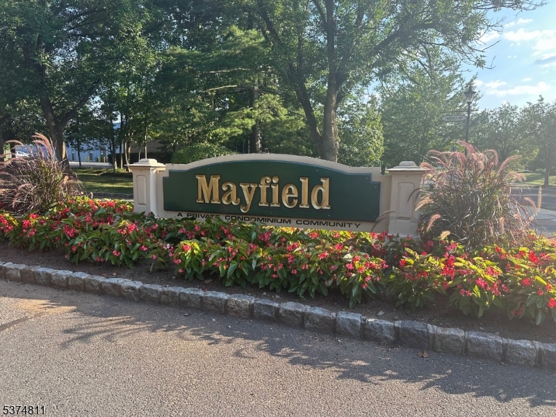 66 Mountain Court, Unit 66 Bedminster, NJ 07921 - Photo 18 of 18 a sign that is next to a road