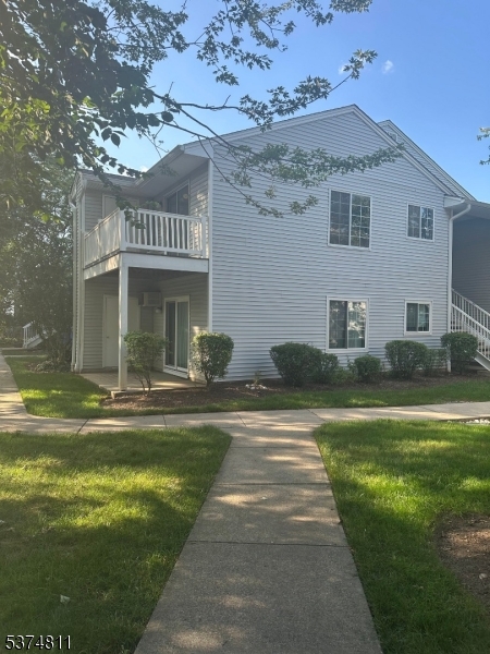 66 Mountain Court, Unit 66 Bedminster, NJ 07921 - Photo 2 of 18 a view of a house with swimming pool