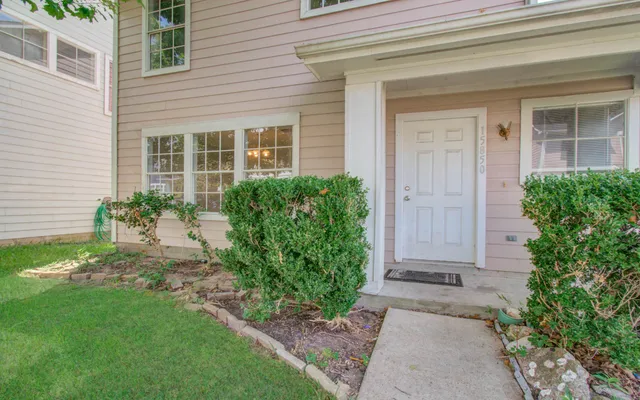 a front view of a house with garden