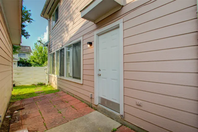 a view of a door and a window