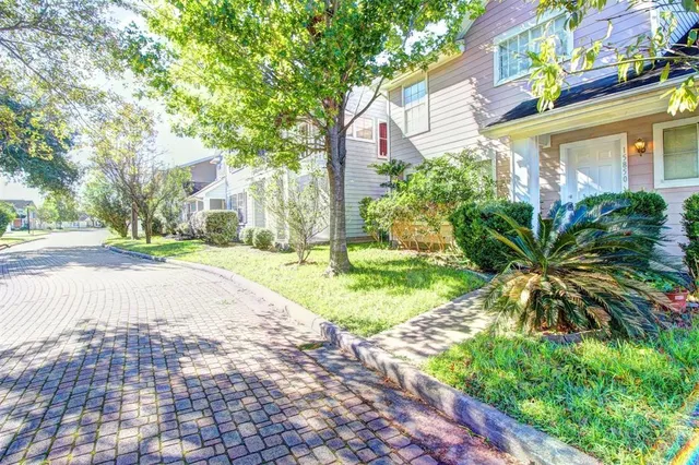 a view of a street with a building in the background