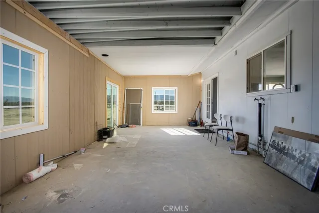 a view of a livingroom with furniture and windows