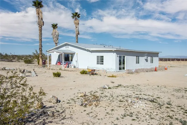 a front view of a house with a ocean view