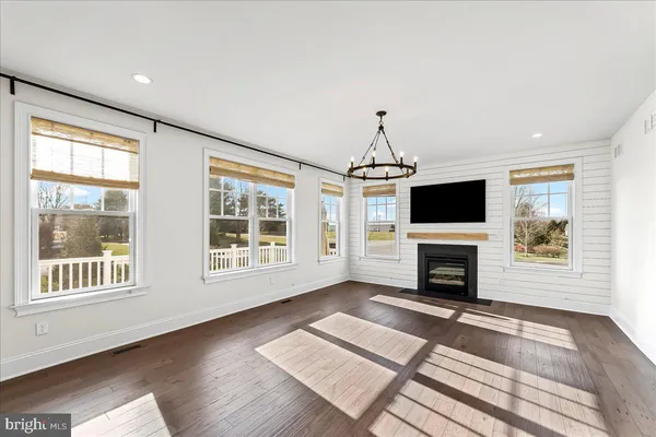 a living room with furniture fireplace and flat screen tv