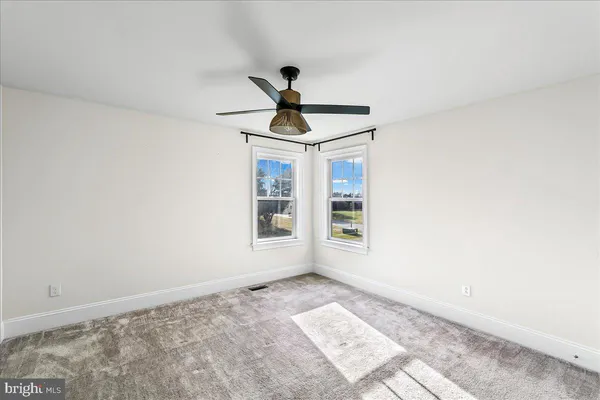 a view of empty room with windows