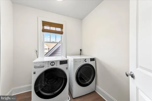 a view of a hallway with washer and dryer