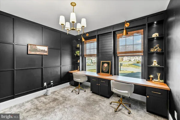 a room with chandelier furniture and windows