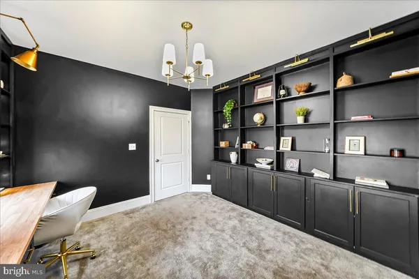 a kitchen with stainless steel appliances kitchen island granite countertop a refrigerator a stove and a sink with wooden floor