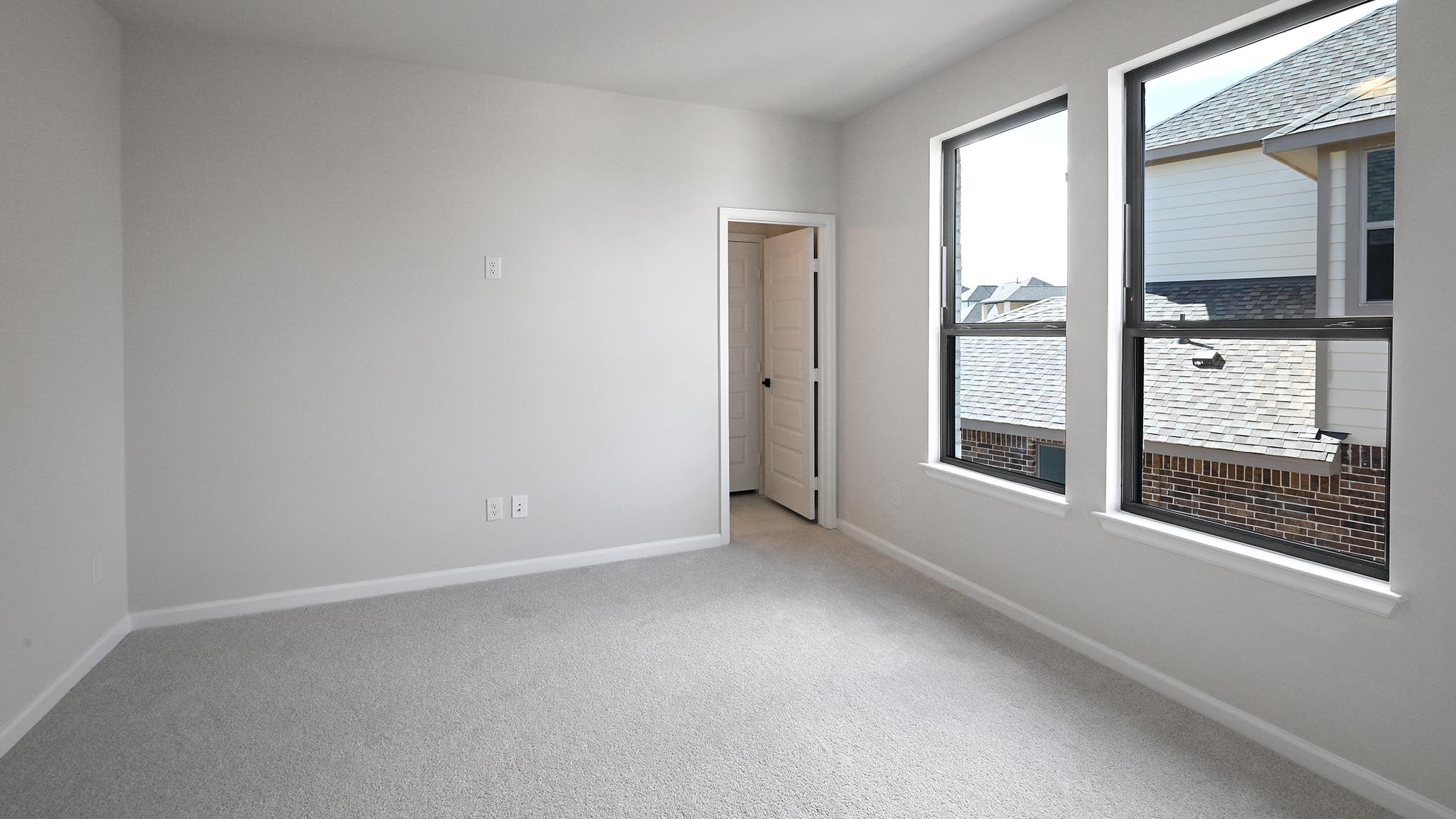 239 Prickly Poppy Loop Kyle, TX 78640 - Photo 16 of 26 an empty room with windows
