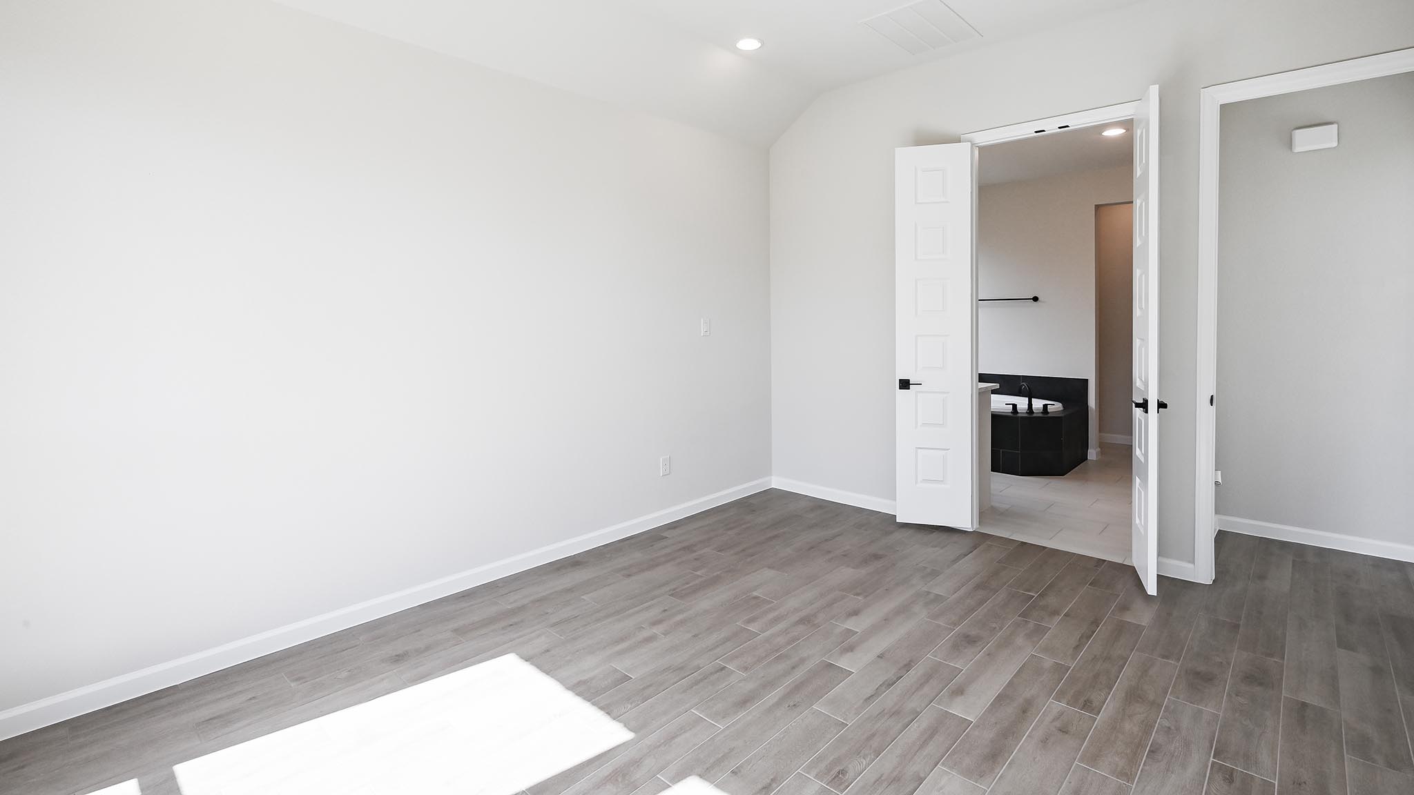 239 Prickly Poppy Loop Kyle, TX 78640 - Photo 18 of 26 an empty room with wooden floor