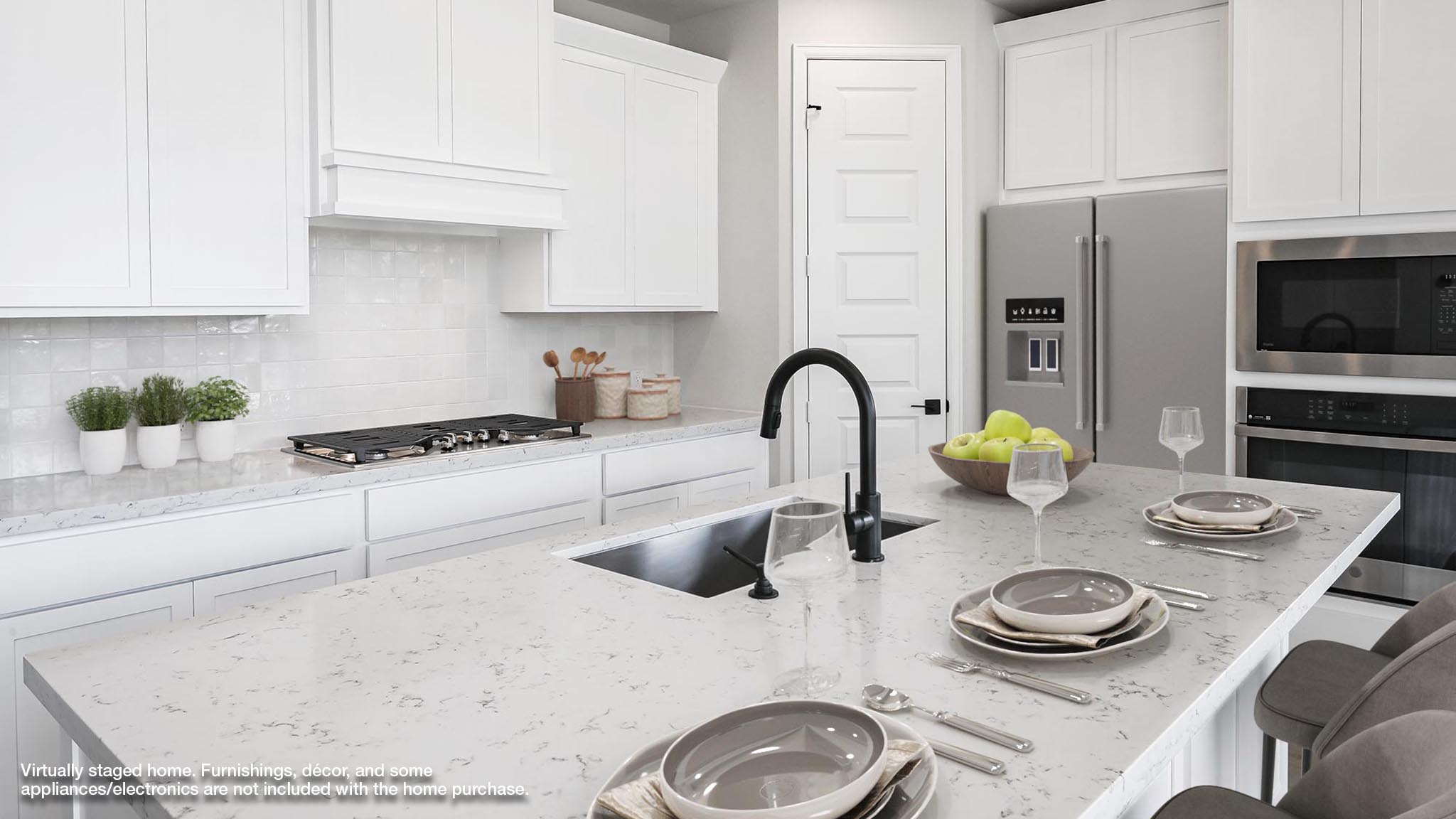 239 Prickly Poppy Loop Kyle, TX 78640 - Photo 2 of 26 a kitchen with appliances a sink and cabinets