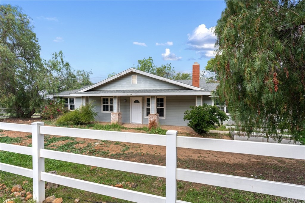 33796 Arthur Road Winchester, CA 92596 - Photo 1 of 54 a front view of a house with a porch