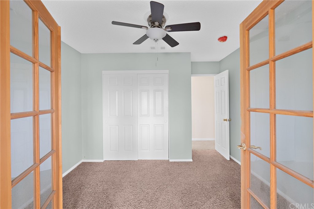 33796 Arthur Road Winchester, CA 92596 - Photo 19 of 54 a view of a bedroom with a ceiling fan