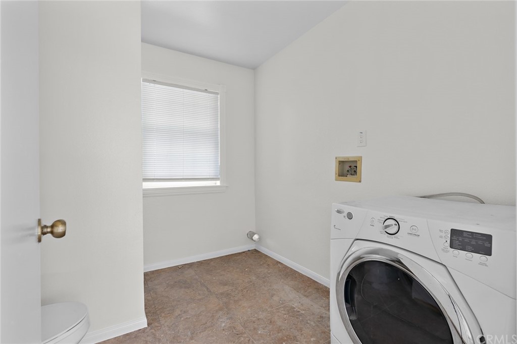 33796 Arthur Road Winchester, CA 92596 - Photo 23 of 54 a view of a hallway with washer and dryer