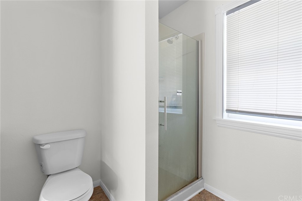 33796 Arthur Road Winchester, CA 92596 - Photo 24 of 54 a white toilet sitting next to a bathroom sink