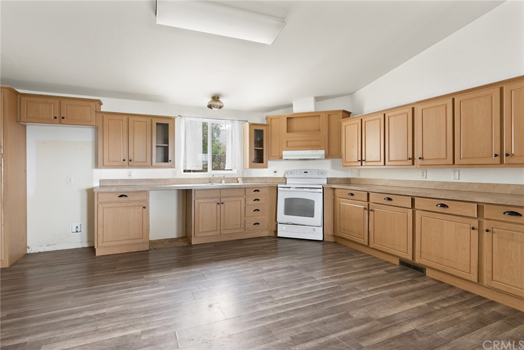 33796 Arthur Road Winchester, CA 92596 - Photo 39 of 54 a kitchen with stainless steel appliances granite countertop a stove top oven a sink dishwasher and a refrigerator