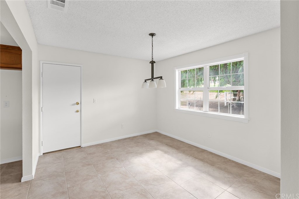 33796 Arthur Road Winchester, CA 92596 - Photo 7 of 54 a view of an empty room with a window
