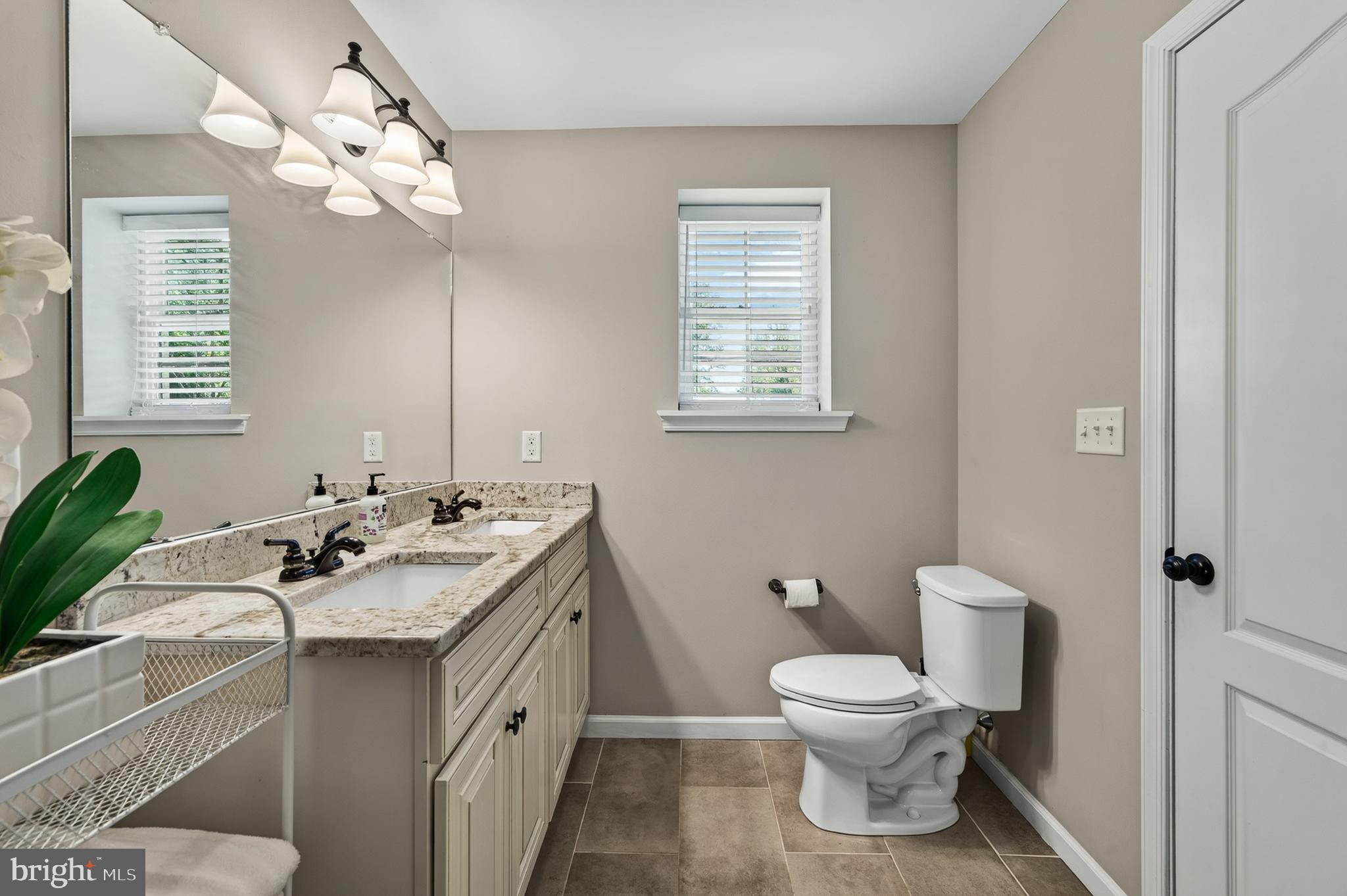 246 Oak Park Road Hatfield, PA 19440 - Photo 19 of 45 a bathroom with a sink toilet and a mirror