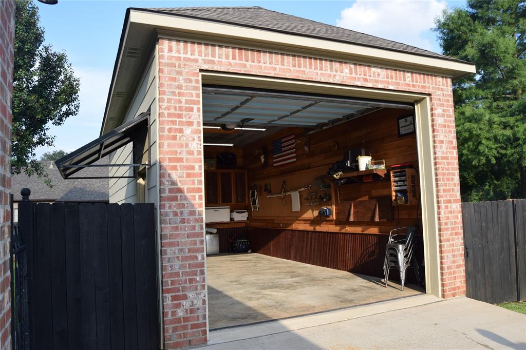 605 Jade Haughton, LA 71037 - Photo 32 of 34 Brick-front Shop with an overhead door,cedar walls,built cainets and concrete flooring