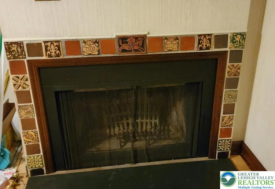 444 West 3rd Street, Unit 9 Bethlehem, PA 18015 - Photo 14 of 16 Ornate tiled fireplace surround adds historical charm to this cozy living space.