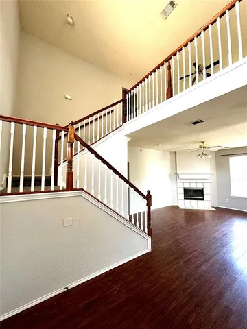 a view of an entryway with wooden floor
