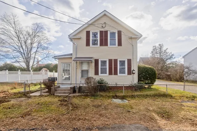 a front view of a house with a yard