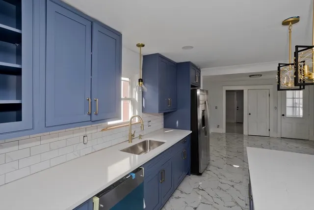 a kitchen with a sink and cabinets