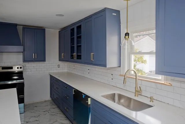 a kitchen with a sink and a window
