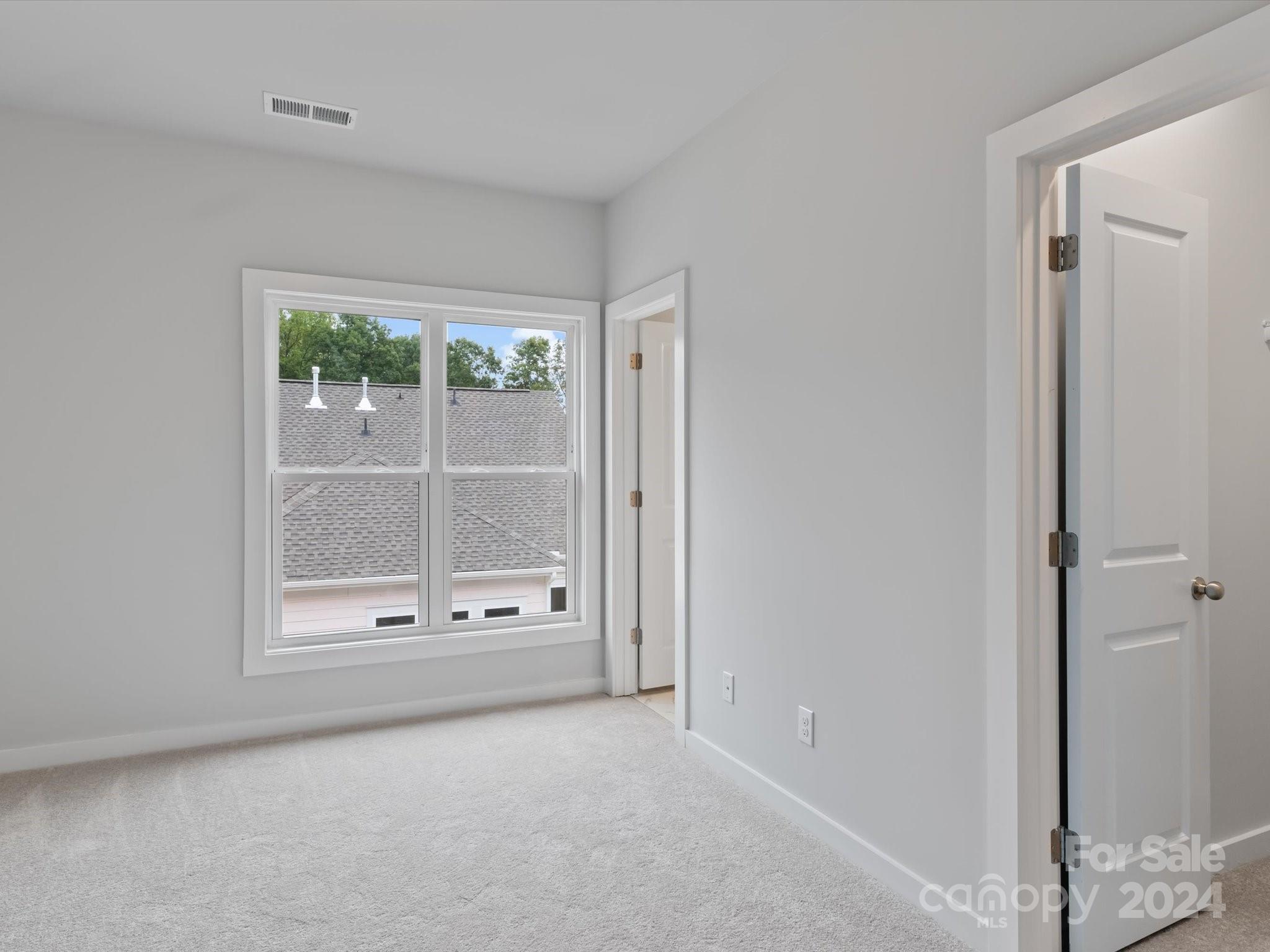 230 Gilead Road Huntersville, NC 28078 - Photo 13 of 19 a view of an empty room with a window