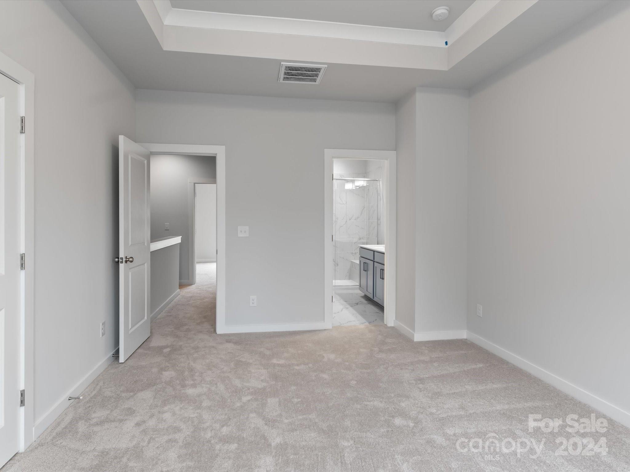 230 Gilead Road Huntersville, NC 28078 - Photo 17 of 19 a view of a room with an empty space and wooden floor