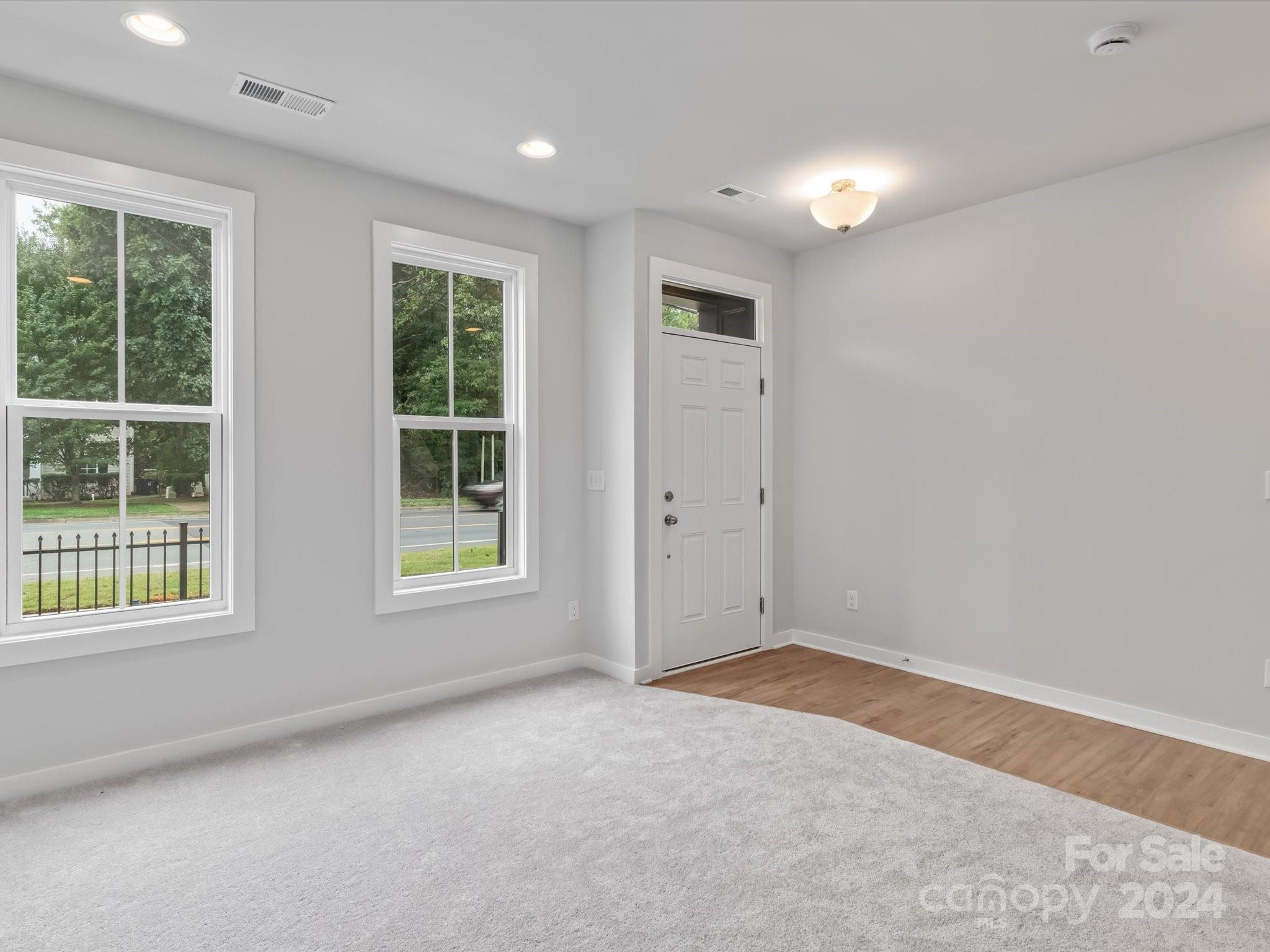 230 Gilead Road Huntersville, NC 28078 - Photo 4 of 19 an empty room with windows