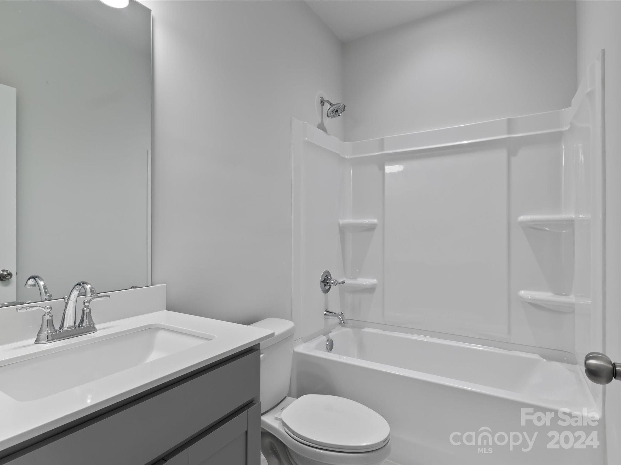 230 Gilead Road Huntersville, NC 28078 - Photo 5 of 19 a bathroom with a sink toilet vanity and shower