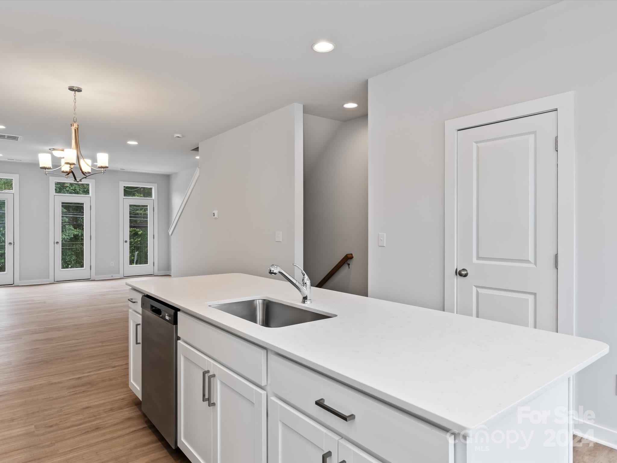 230 Gilead Road Huntersville, NC 28078 - Photo 7 of 19 a room with a sink and chandelier