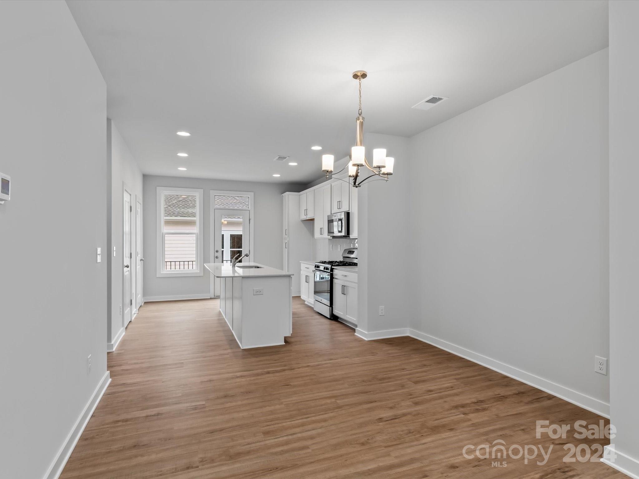 230 Gilead Road Huntersville, NC 28078 - Photo 8 of 19 a view of a kitchen and a sink