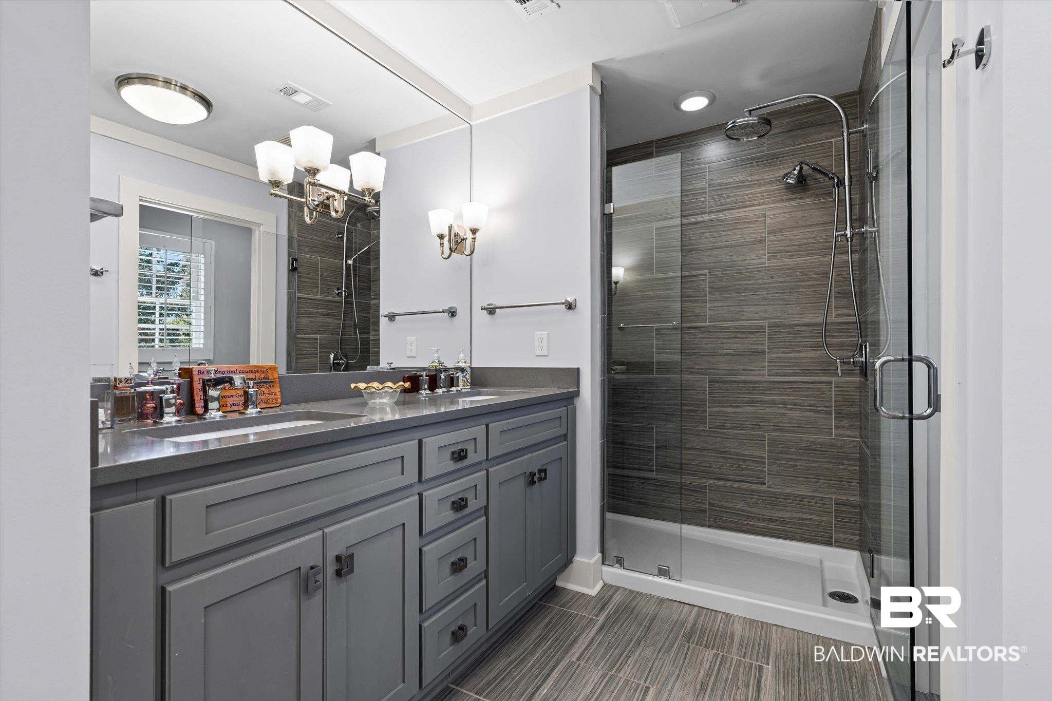 4776 Falls Church Road Mobile, AL 36608 - Photo 27 of 45 Spacious bathroom featuring a dual vanity with a gray countertop, gray shaker-style cabinetry, and a full-width mirror