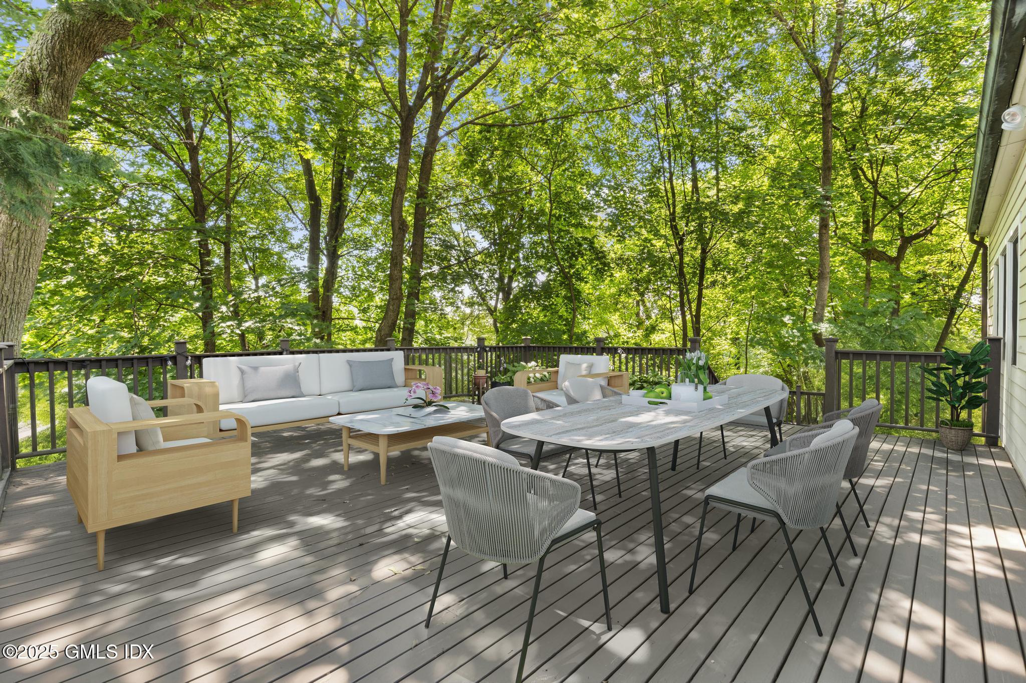 15 Ridge Road Cos Cob, CT 06807 - Photo 11 of 15 a view of backyard with a table and chairs