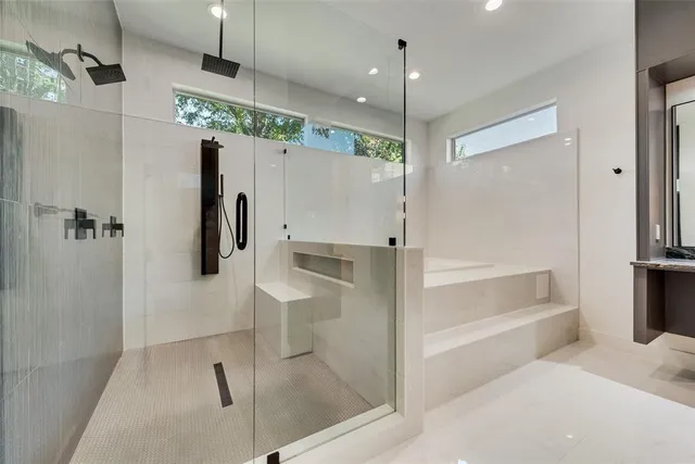 a bathroom with a bathtub and a shower