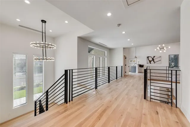 a view of a room with wooden floor and stairs