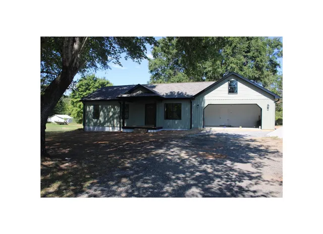 a black and white photo of a house