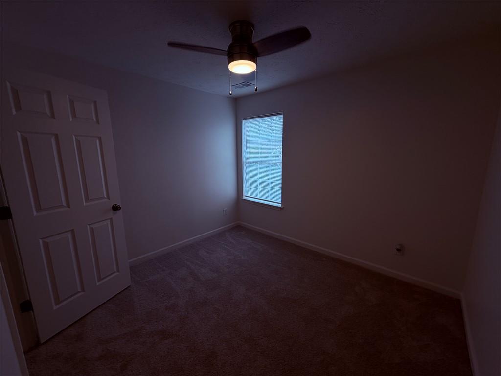 28 Hampton Drive Cartersville, GA 30121 - Photo 19 of 24 an empty room with a empty space and a window