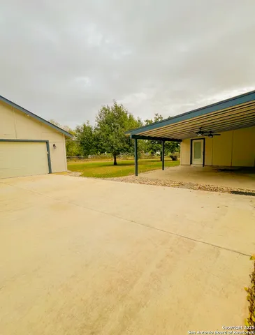 a house view with swimming pool in front of it
