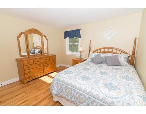 23 Hawthorne Road Ashland, MA 01721 - Photo 11 of 41 a bedroom with a bed and a mirror