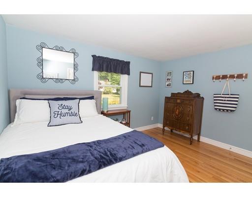 23 Hawthorne Road Ashland, MA 01721 - Photo 14 of 41 a bedroom with a bed and dresser with wooden floor