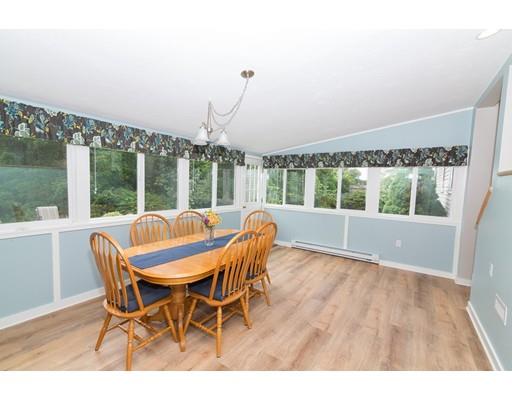 23 Hawthorne Road Ashland, MA 01721 - Photo 23 of 41 a dining room with furniture large windows and wooden floor