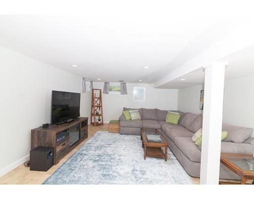 23 Hawthorne Road Ashland, MA 01721 - Photo 28 of 41 a living room with furniture and a flat screen tv